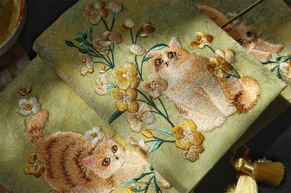 Handmade garden cat embroidered journal by STAR WISH featuring a detailed cat design on a textured cover.