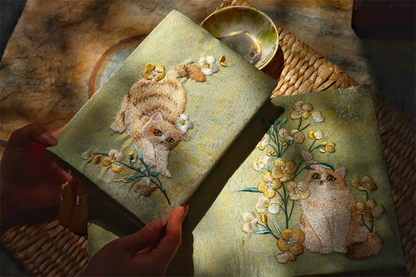Handmade garden-themed cat embroidered journal by STAR WISH, featuring detailed cat and floral embroidery on the cover.