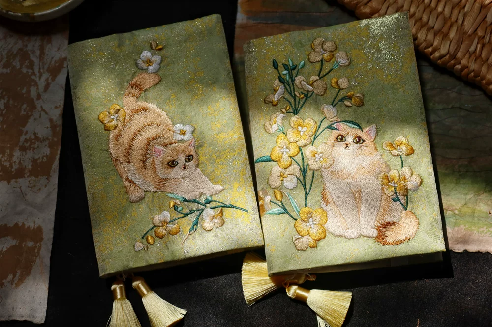 Handmade garden-themed embroidered journal by STAR WISH featuring cat designs on the cover, ideal for writing and note-taking.