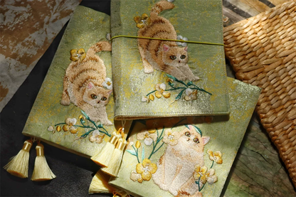 Handmade STAR WISH garden cat embroidered journal with floral design on the cover, featuring detailed cat and flower embroidery.