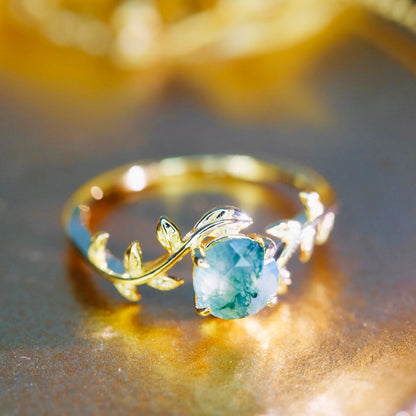 Sterling silver ring with natural moss agate leaf design, 14K gold plating, featuring intricate leaf details for elegant jewelry.