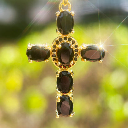 Gold cross pendant necklace with black crytal gemstones 