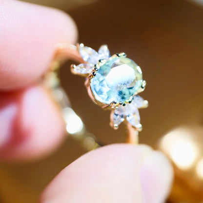 STAR WISH adjustable blue topaz wing ring featuring a detailed wing design and vibrant blue gemstone on a silver band.