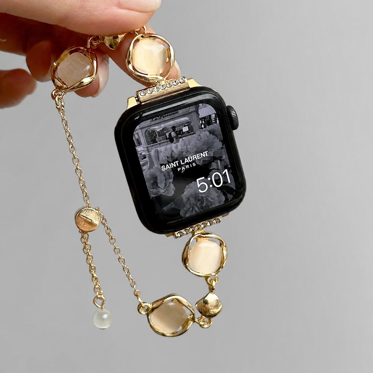 Gold sculpted shell Apple Watch band detail
