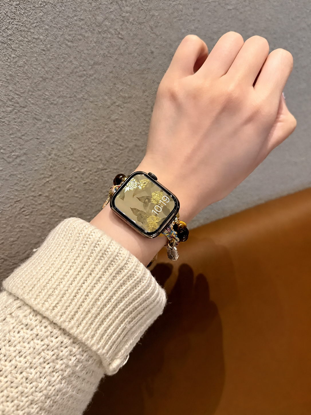 Multicolor woven Apple Watch band on wrist