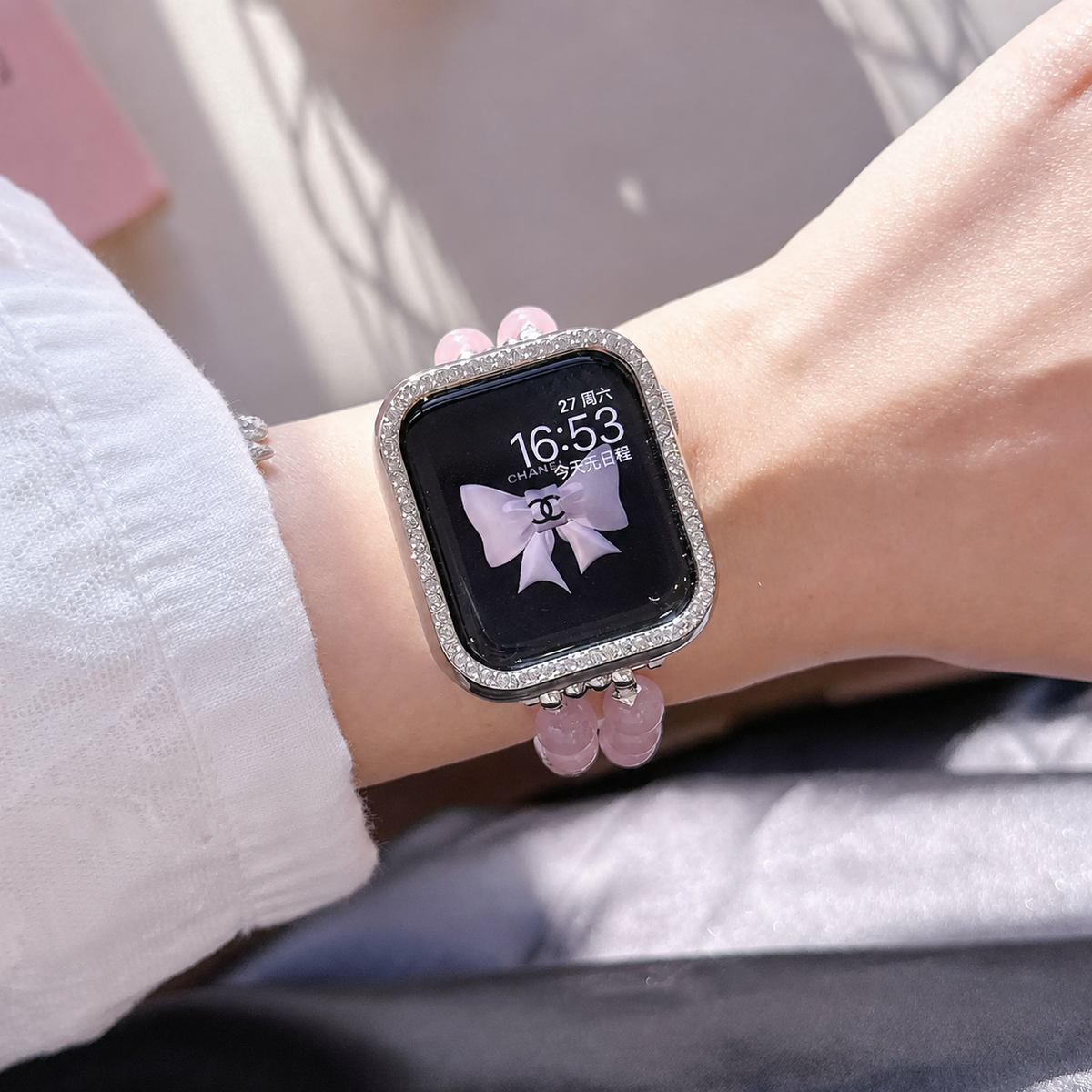 Pink cat eye pearl Apple Watch band on wrist