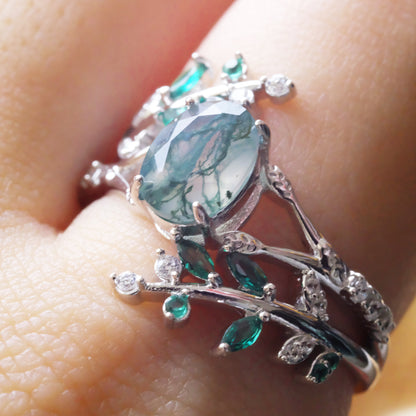Sterling silver ring featuring an oval moss agate gemstone and leaf design, crafted by STAR WISH.