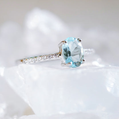 Oval aquamarine silver ring with simulated diamond accents