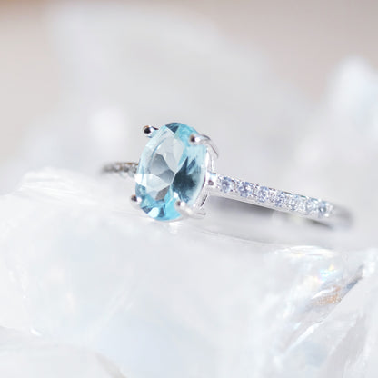 Oval aquamarine silver ring with simulated diamond accents
