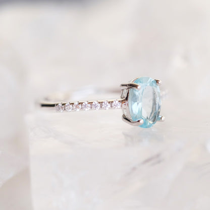 Oval aquamarine silver ring with simulated diamond accents