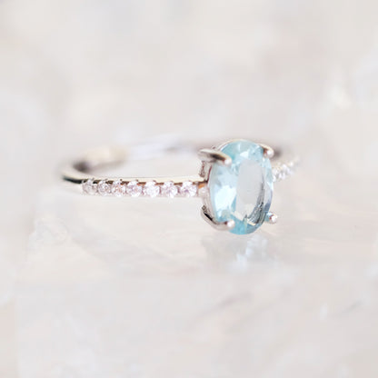 Oval aquamarine silver ring with simulated diamond accents