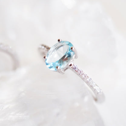 Oval aquamarine silver ring with simulated diamond accents