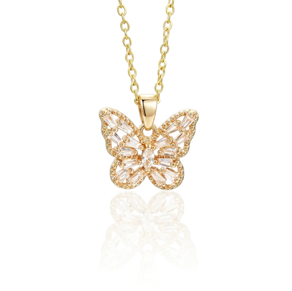 Gold butterfly necklace with clear gemstones on a white background
