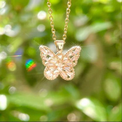 Pink, purple, and white butterfly necklace by STAR WISH featuring a delicate pendant on a fine chain.