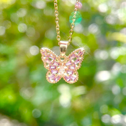 Pink, purple, and white butterfly necklace by STAR WISH featuring a delicate butterfly pendant on a silver chain.
