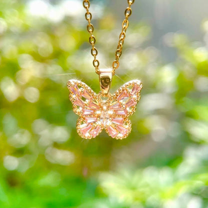 Pink, purple, and white butterfly necklace by STAR WISH featuring a delicate butterfly pendant on a silver chain.