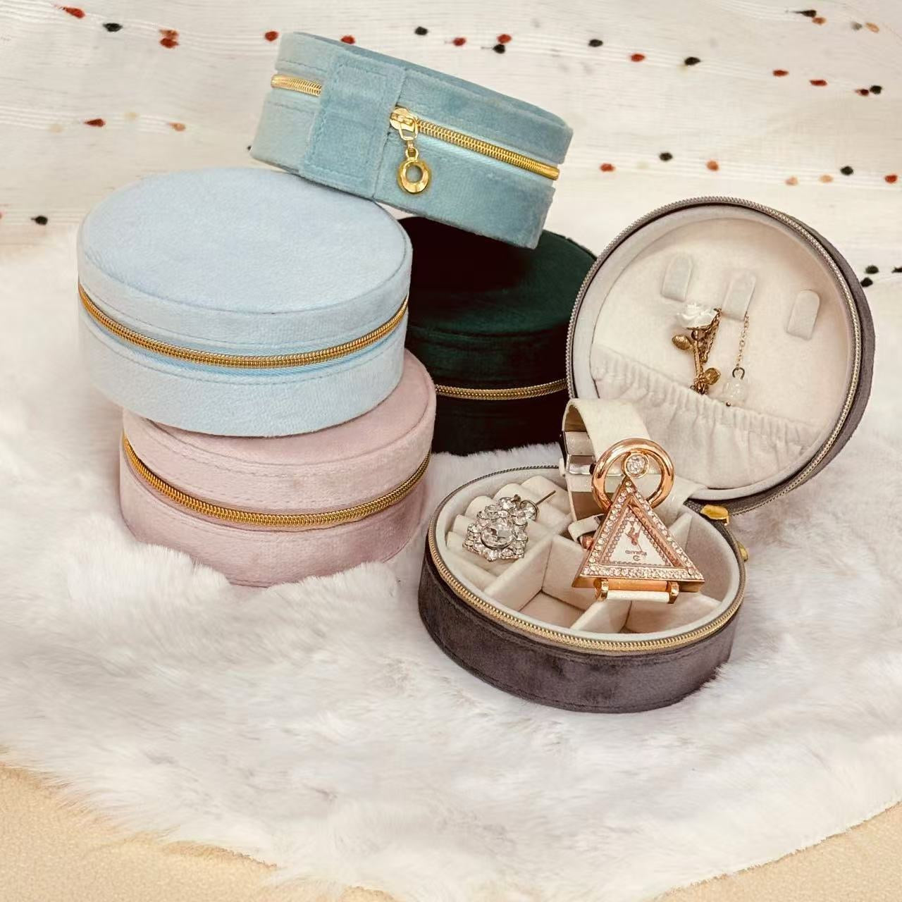 STAR WISH round velvet travel jewelry case organizer with compartments for necklaces, rings, and earrings on a white background.
