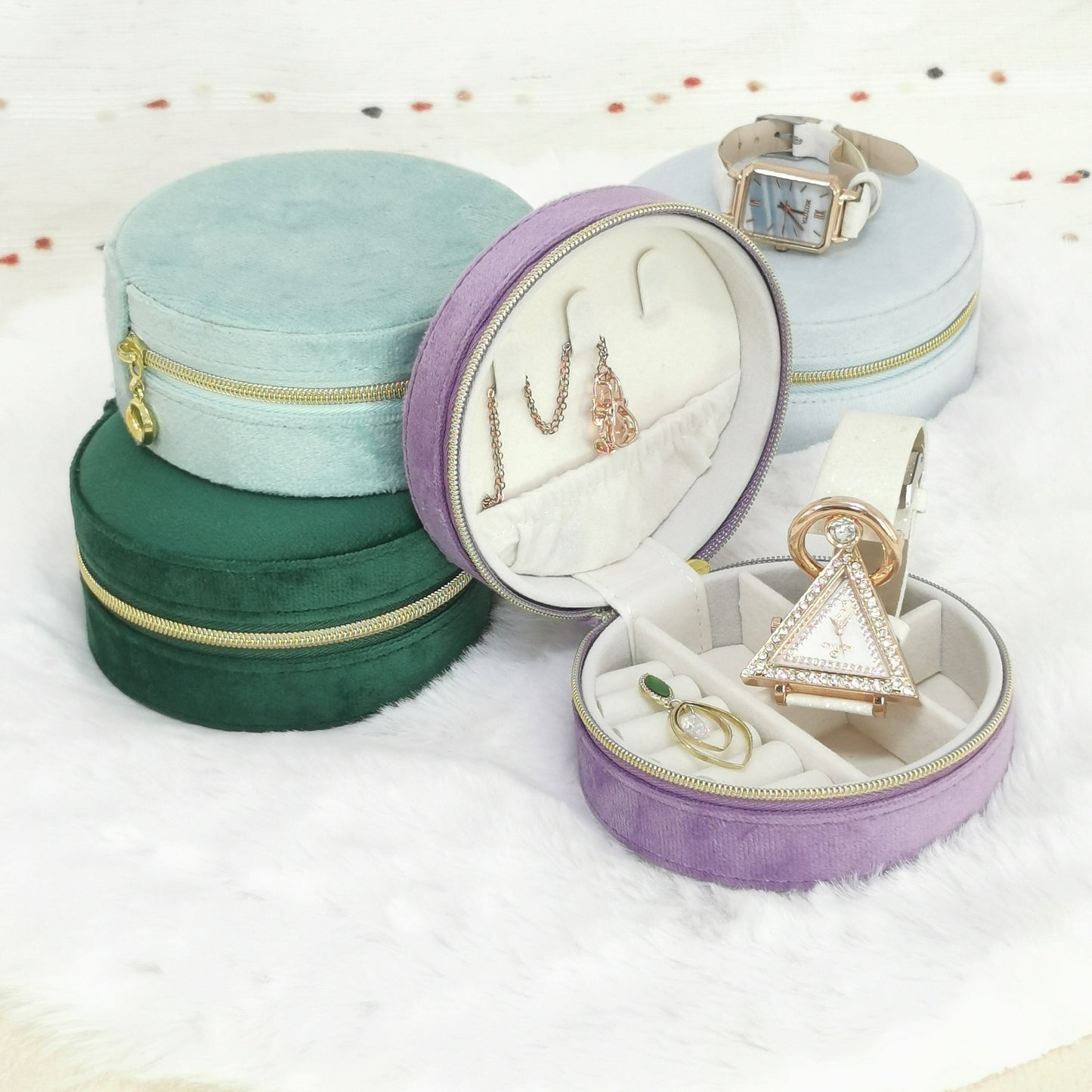 STAR WISH round velvet travel jewelry case organizer with compartments for necklaces, rings, and earrings on a white background.