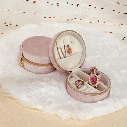 Star Wish round velvet travel jewelry case organizer with multiple compartments and a secure snap closure.
