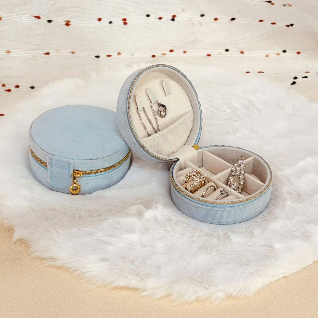 Round velvet travel jewelry case organizer by STAR WISH, showcasing a soft, plush exterior with compartments for jewelry storage.