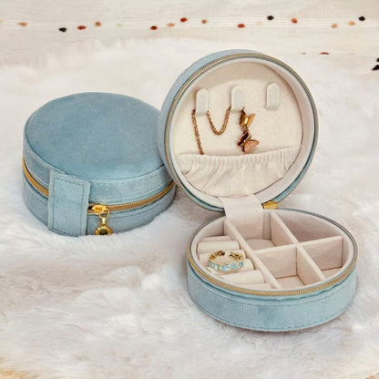Round velvet travel jewelry case organizer by STAR WISH, with compartments for necklaces, rings, and earrings.