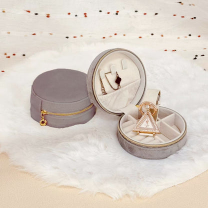 Round velvet travel jewelry case organizer by STAR WISH with compartments for necklaces, rings, and earrings.