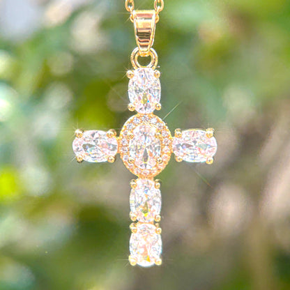Gold cross pendant necklace with clear white gemstones 