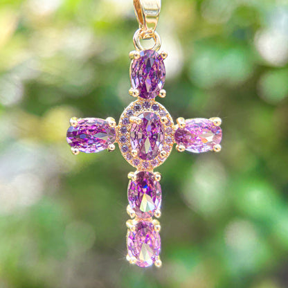 Gold cross pendant necklace with purple gemstones