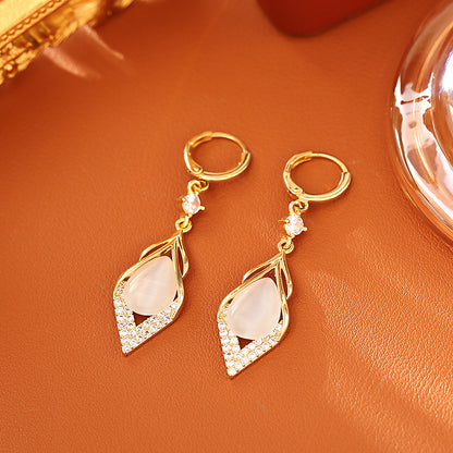 STAR WISH cat eye zircon teardrop earrings worn detail