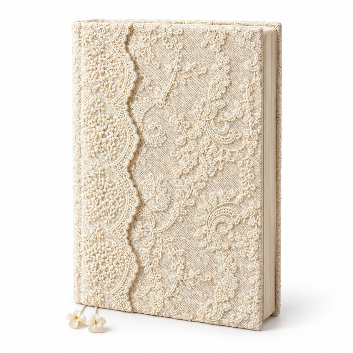 Closed ivory floral lace journal standing upright on white with two flower bookmarks