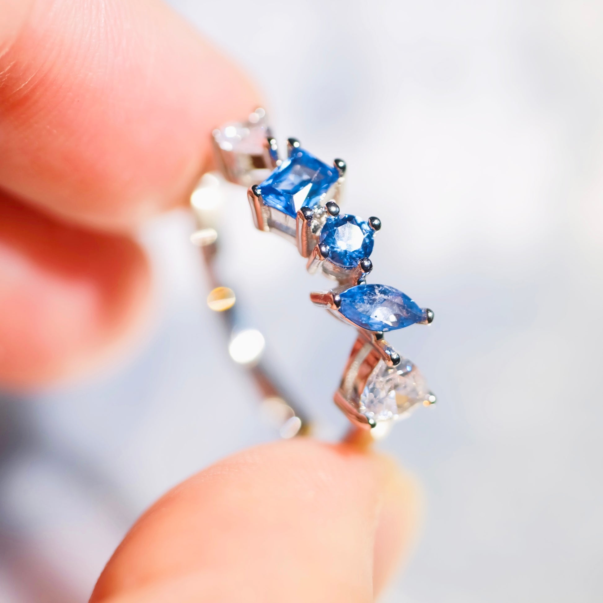 Close up of colorful gemstones on STAR WISH blue adjustable ring