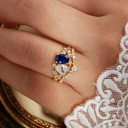 Lab-grown blue sapphire and moissanite floral branch ring set worn on hand