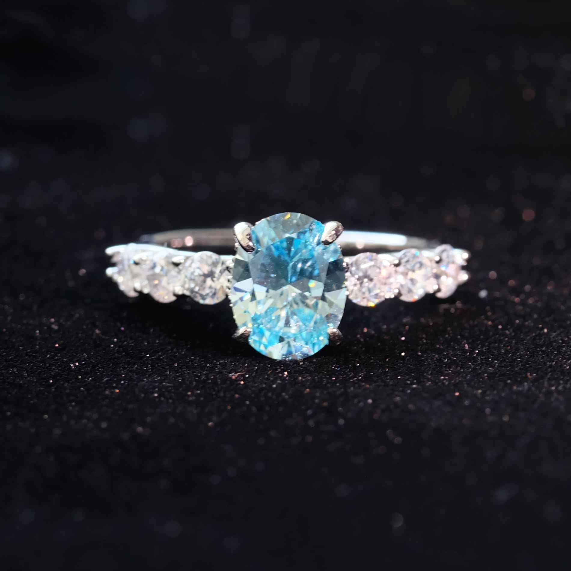 Side view of STAR WISH ocean blue zircon solitaire ring