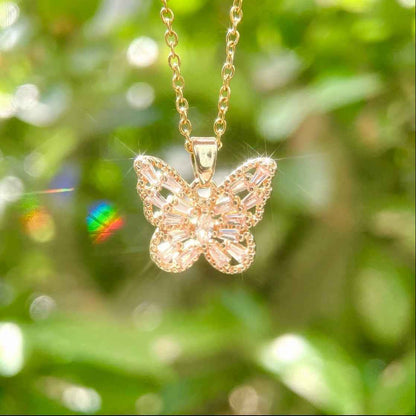 STAR WISH butterfly necklace in pink purple and white shown as lifestyle jewelry photo