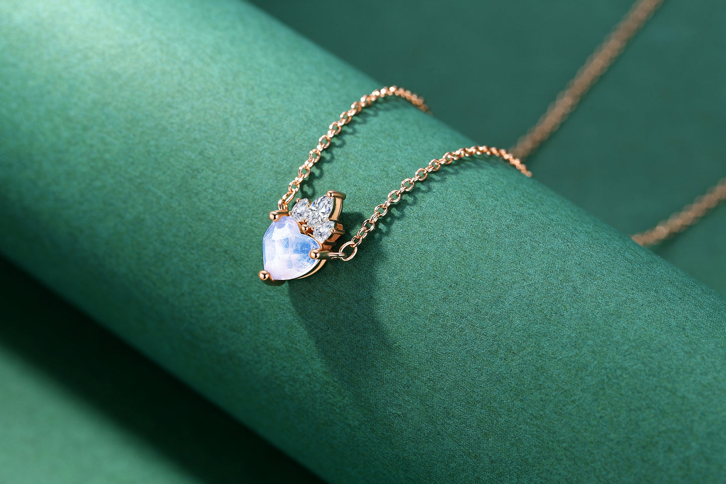 Detail view of STAR WISH crown heart moonstone pendant with rose gold plated silver