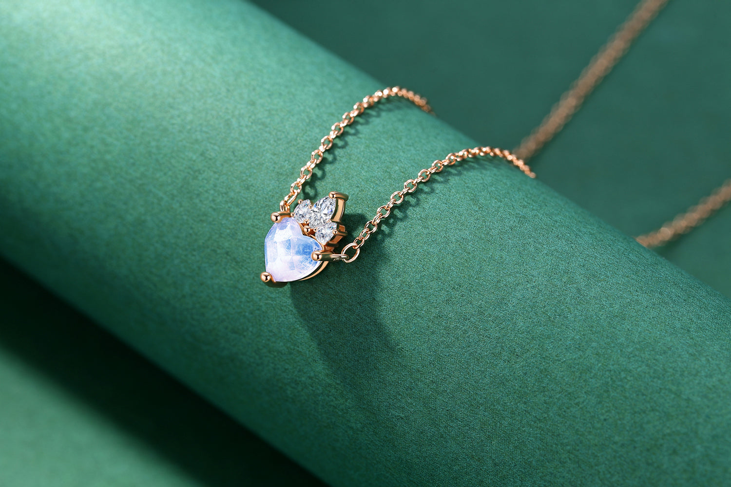Detail view of STAR WISH crown heart moonstone pendant with rose gold plated silver