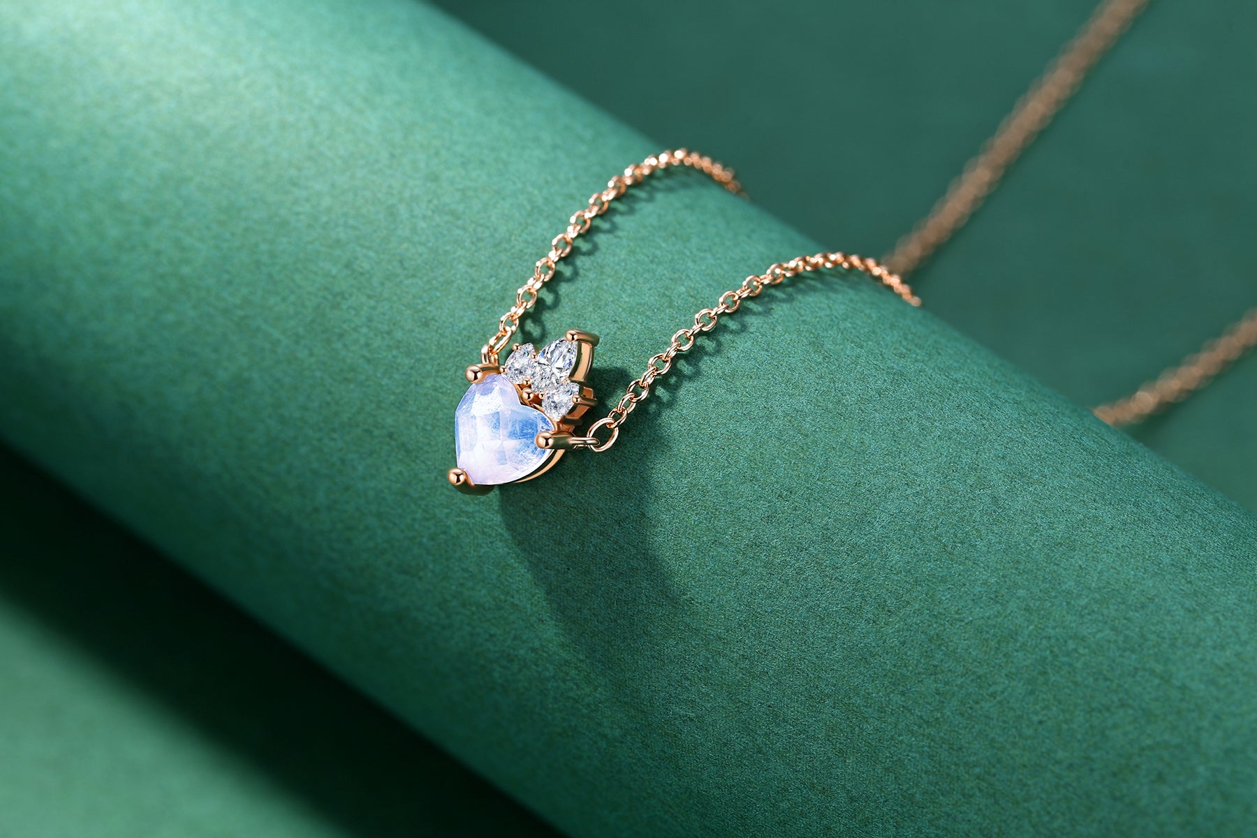Detail view of STAR WISH crown heart moonstone pendant with rose gold plated silver
