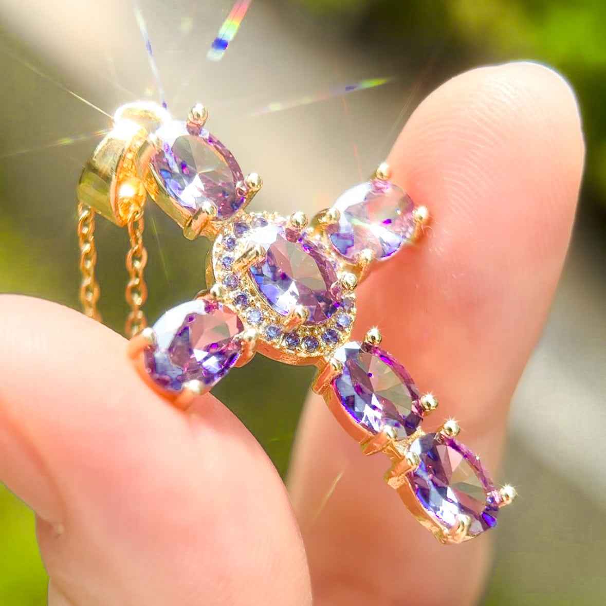 STAR WISH crystal cross necklace shown with jewelry packaging