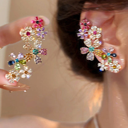 STAR WISH floral tassel stud earrings worn view with multicolor crystal details