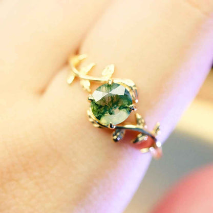 Detail view of STAR WISH gold plated moss agate leaf ring