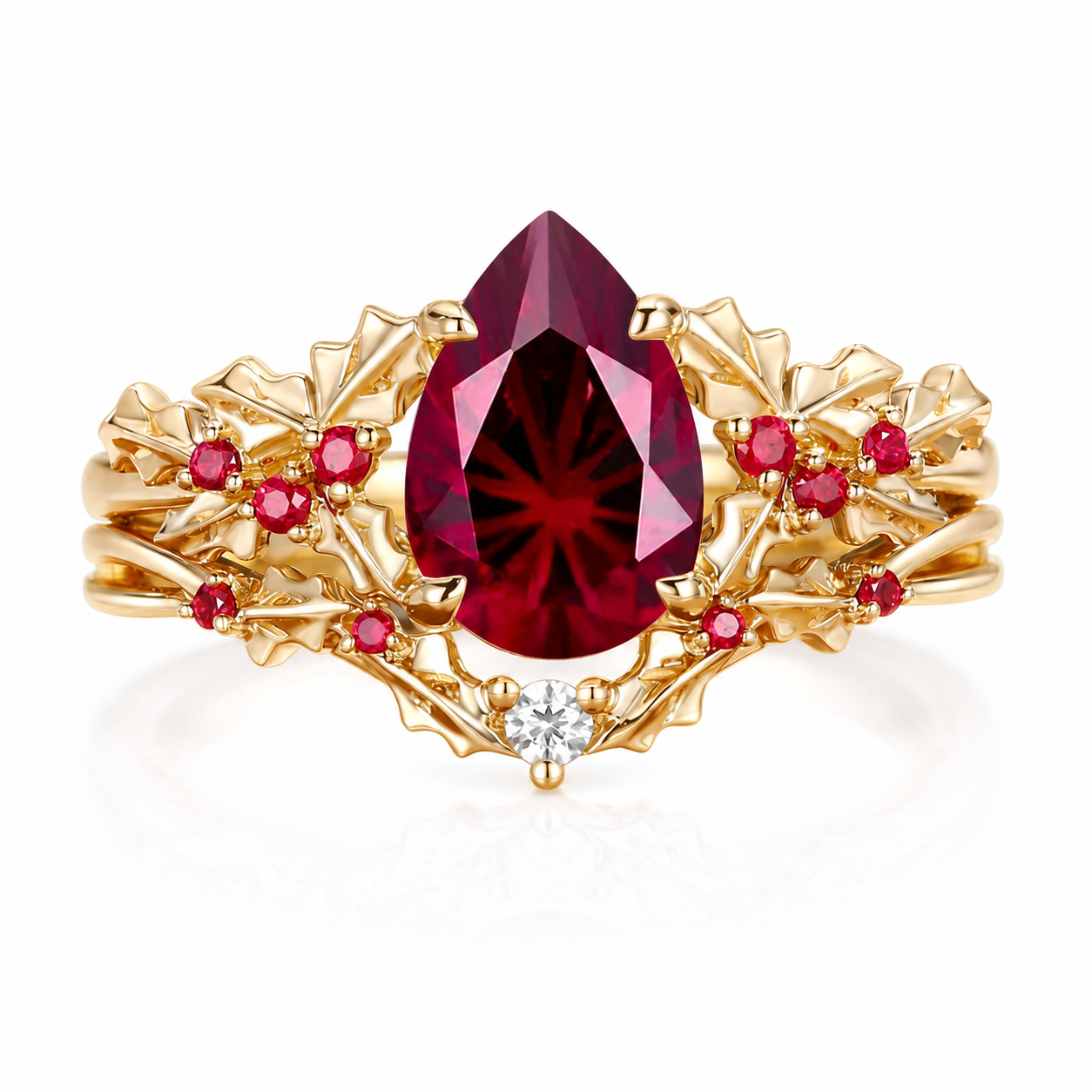 Handmade pear-cut lab-grown pigeon blood ruby leaf ring set on white background