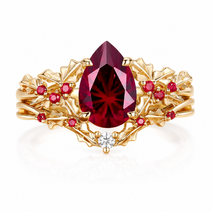 Handmade pear-cut lab-grown pigeon blood ruby leaf ring set on white background