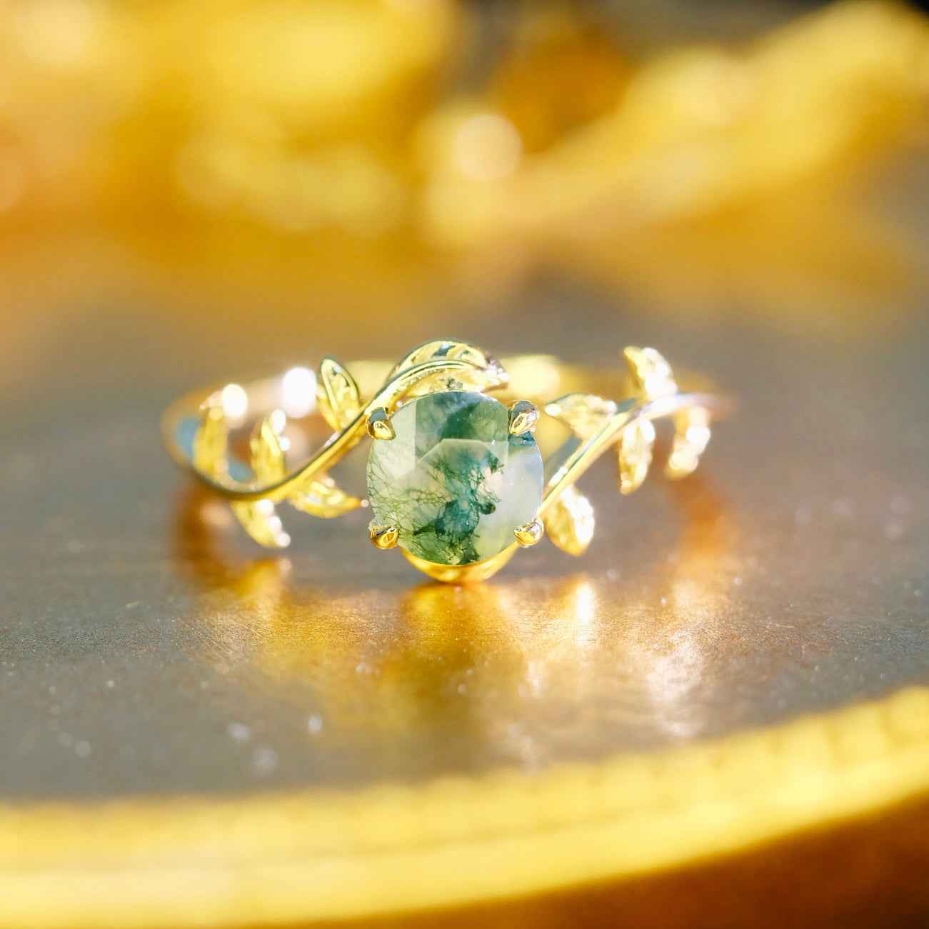 Side view of STAR WISH moss agate leaf ring with gold plated silver setting