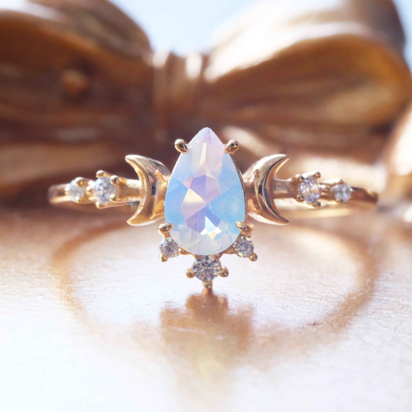 Side view of STAR WISH moonlight opal ring with gold plated silver band