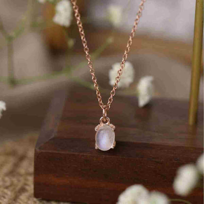 Detail view of STAR WISH oval moonstone pendant necklace with rose gold plating