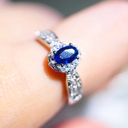 Close up of oval blue sapphire gemstone on STAR WISH adjustable ring