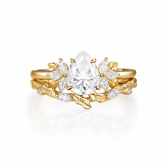 STAR WISH pear moissanite leaf bridal ring set on white background