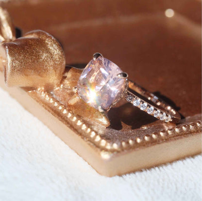 Close up of champagne pink morganite-style gemstone ring