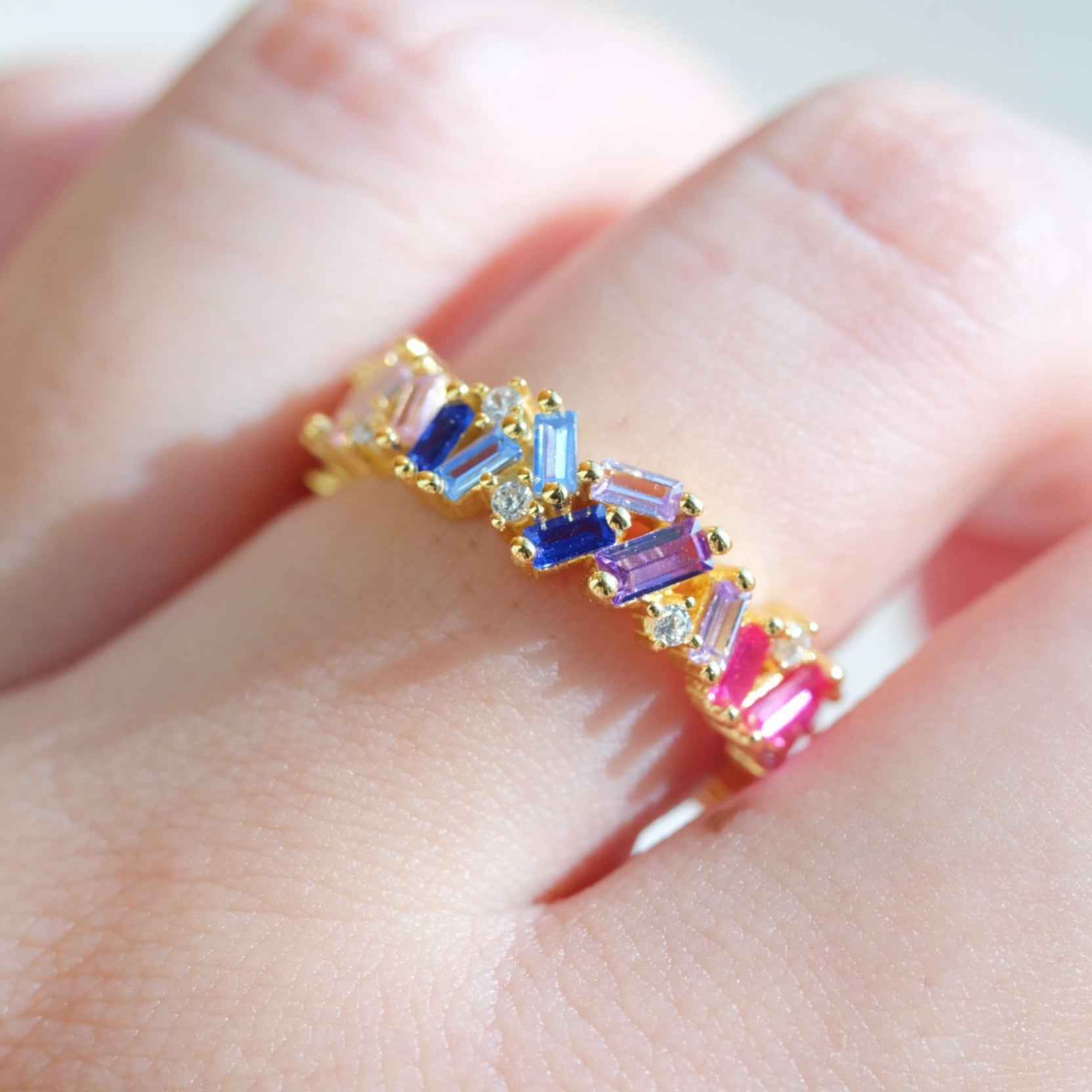 Close up of multicolor zircon stones on STAR WISH rainbow band ring