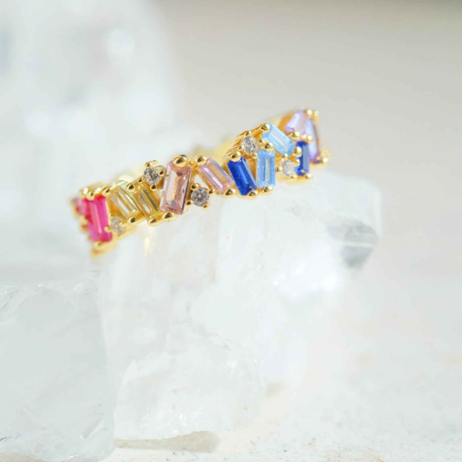 Side view of STAR WISH rainbow zircon band ring with gold plated finish